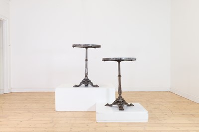 Lot 276 - A pair of marble and polished cast iron bistro tables