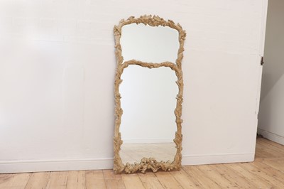 Lot 83 - A carved wooden mirror in the Black Forest style