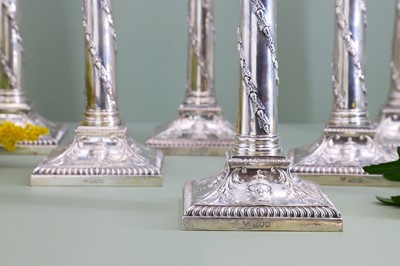 Lot 116 - A composed set of six Edwardian silver candlesticks