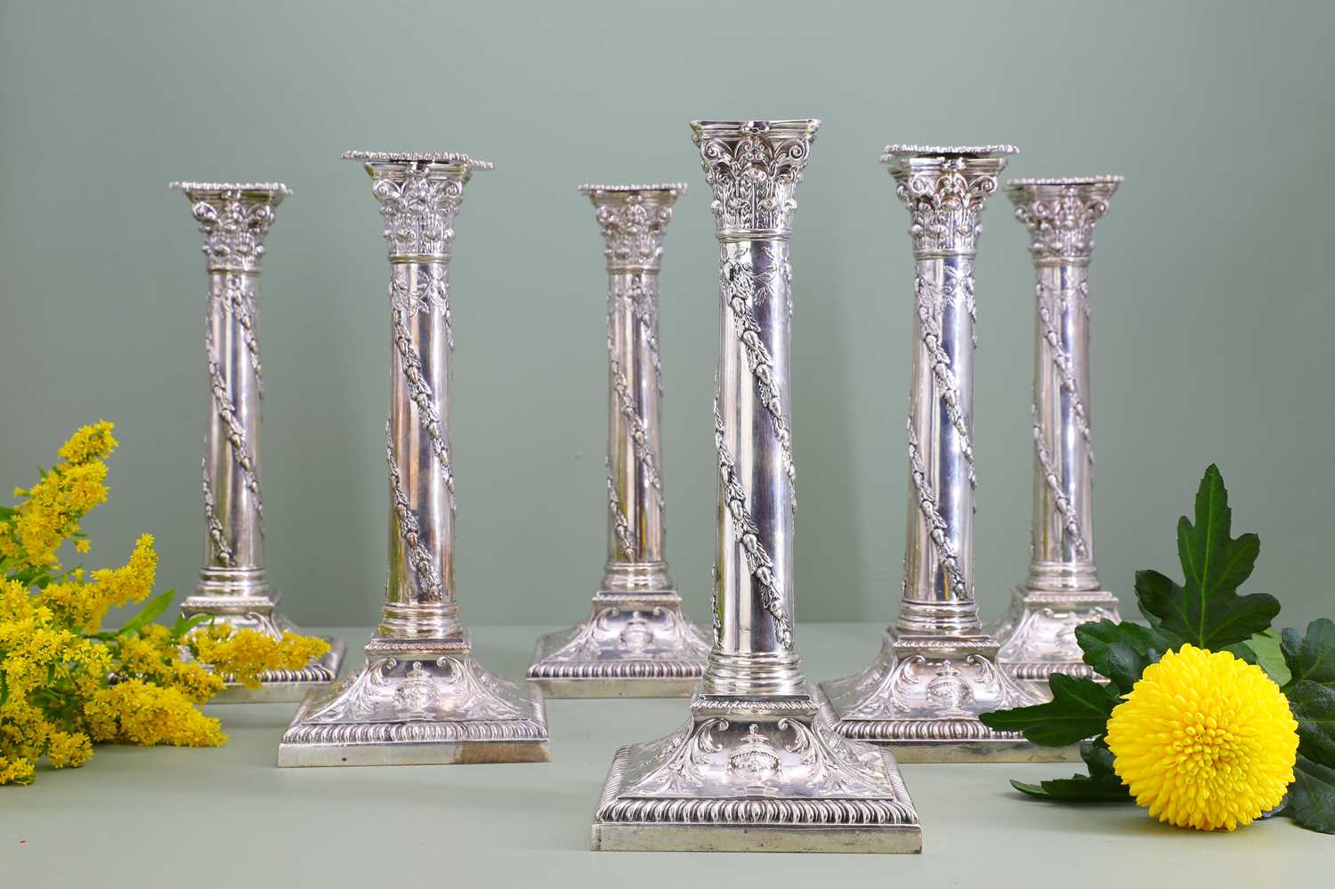 Lot 116 - A composed set of six Edwardian silver candlesticks