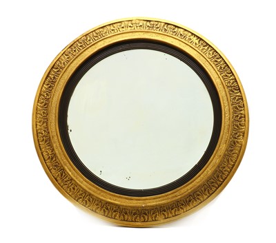 Lot 386 - A circular gilt framed concave wall mirror