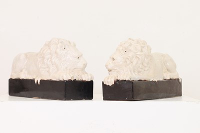 Lot 588 - A pair of large glazed lions after Antonio Canova