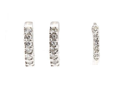 Lot 335 - A pair of diamond hoop earrings