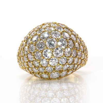 Lot 284 - A Continental gold diamond set bombé ring