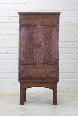 Lot 127 - A Liberty & Co. oak cupboard on stand
