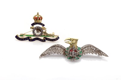 Lot 165 - A diamond and emerald set military wings brooch