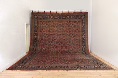 Lot 342 - A large wool Persian carpet