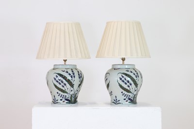 Lot 590 - A pair of porcelain Iznik-style table lamps by OKA