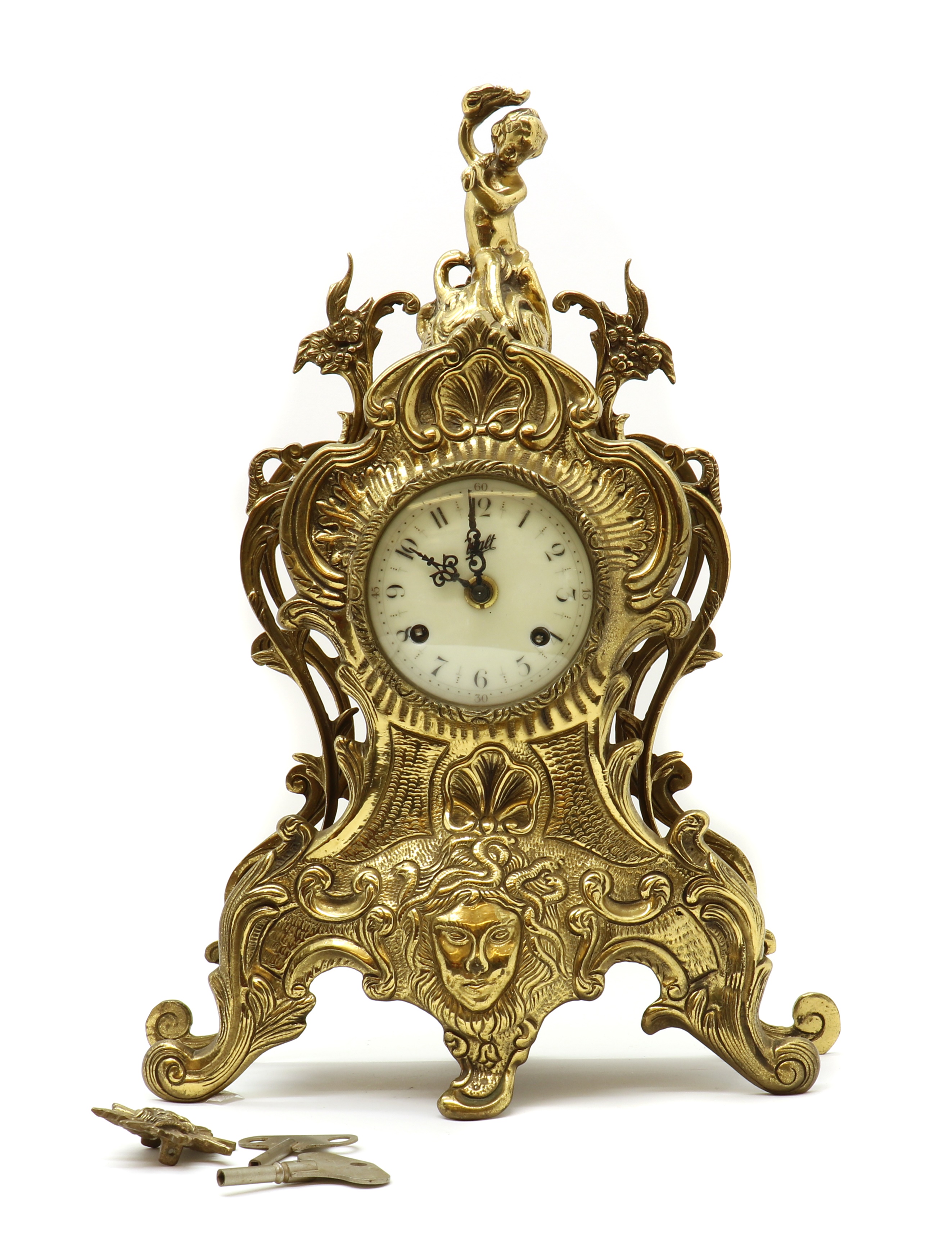 Lot 157 A cast brass mantel clock
