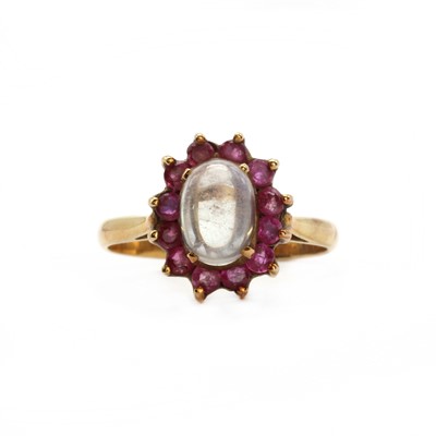 Lot 139 - A gold moonstone and ruby cluster ring