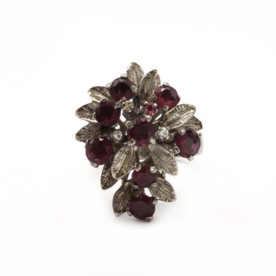 Lot 88 - A gold ruby and diamond spray cluster ring