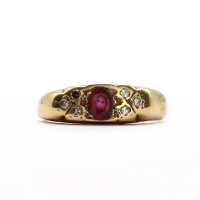 Lot 19 - A gold ruby and diamond carved head ring