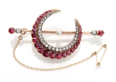 Lot 82 - A late Victorian pearl, ruby and diamond crescent bar brooch, c.1890