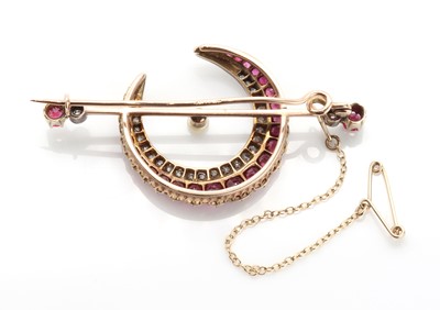Lot 82 - A late Victorian pearl, ruby and diamond crescent bar brooch, c.1890