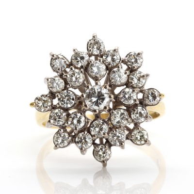 Lot 202 - An 18ct gold diamond set snowflake style cluster ring, c.1970