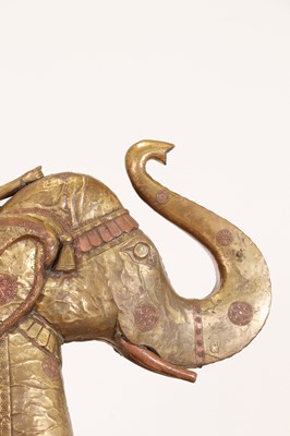 Lot 140 - A large copper and brass-clad pull-along elephant