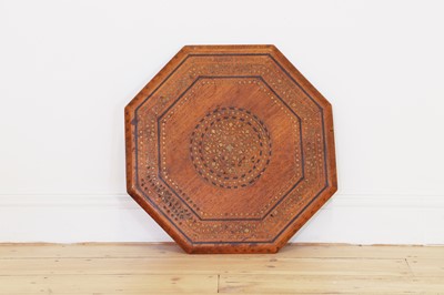Lot 134 - A teak and brass octagonal occasional table