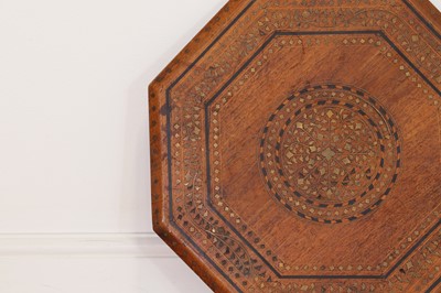 Lot 134 - A teak and brass octagonal occasional table