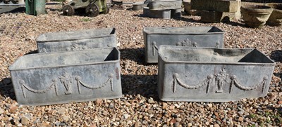 Lot 422 - A set of four lead trough planters