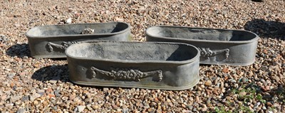 Lot 423 - Three small round end lead troughs