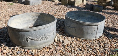 Lot 441 - A pair of circular lead planters
