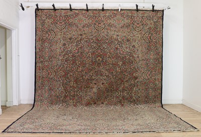 Lot 328 - A large Kirman carpet