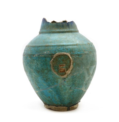 Lot 187 - An Islamic turquoise pottery jar