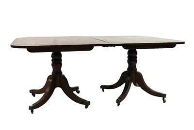 Lot 592 - A Regency mahogany twin pillar dining table