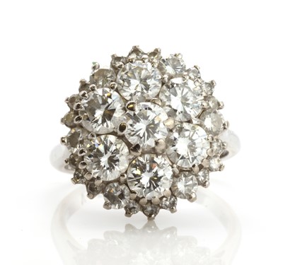 Lot 417 - A white gold three tier hexagonal diamond cluster ring