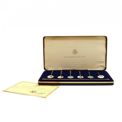 Lot 68 - A cased set of silver gilt and enamelled spoons