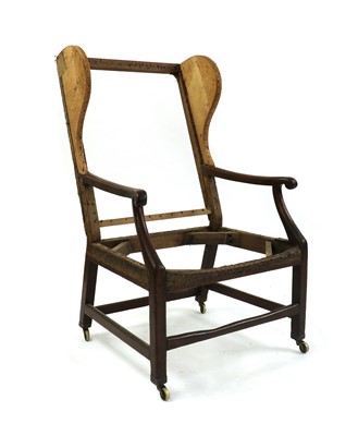 Lot 356 - A George III mahogany wingback armchair frame