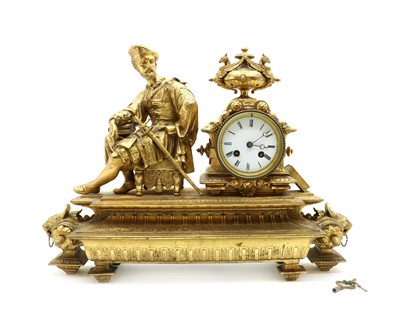 Lot 162 - A gilt metal Empire style mantel clock
