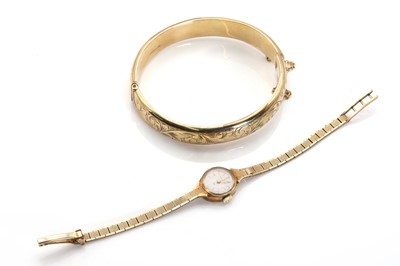 Lot 298 - A 9ct gold hinged bangle