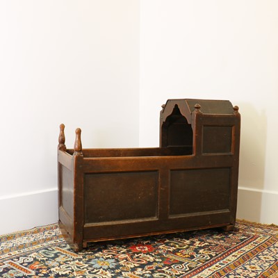 Lot 364 - An oak hooded cradle