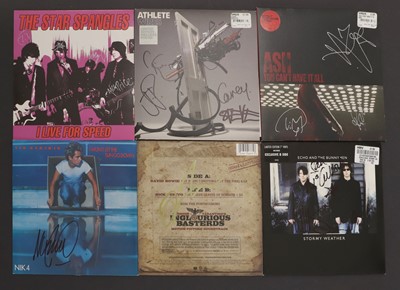 Lot 326 - A collection of signed 45rpm vinyl records