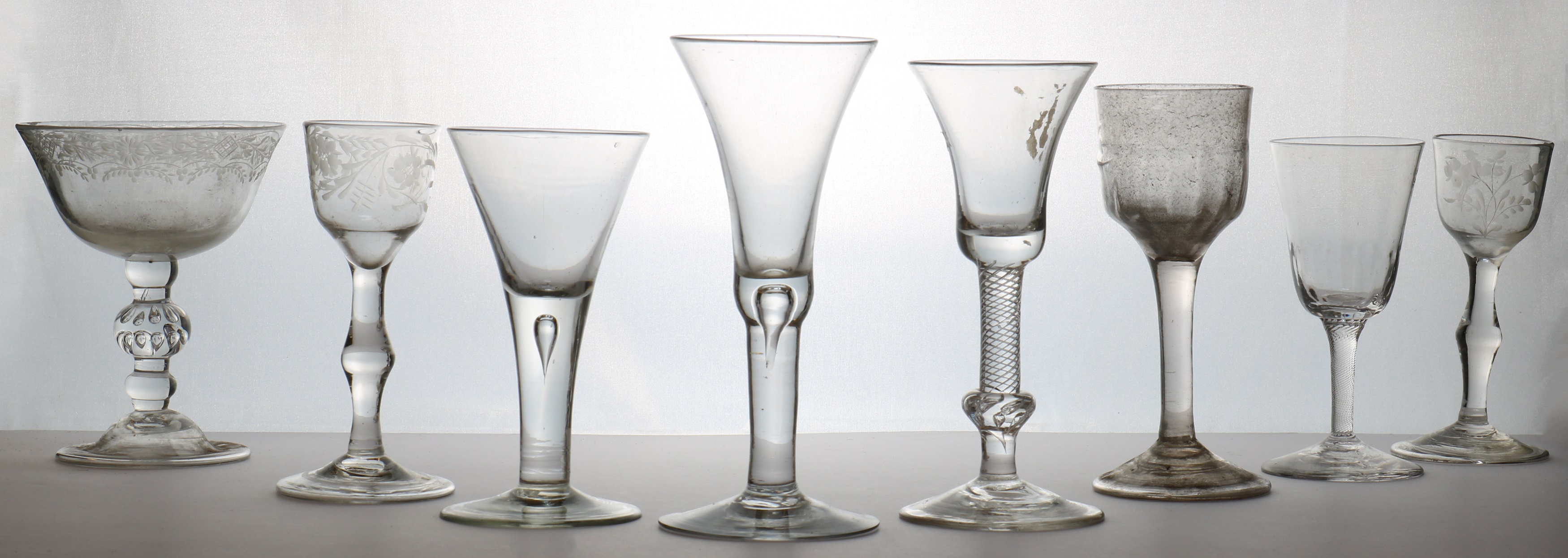 Lot 178 A collection of plain stem drinking glasses