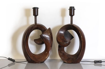 Lot 282 - A pair of patinated bronze lamps