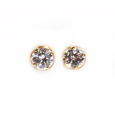 Lot 57 - A pair of single stone diamond stud earrings