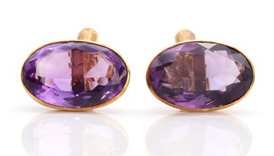 Lot 466 - A pair of 18ct gold single stone amethyst cufflinks