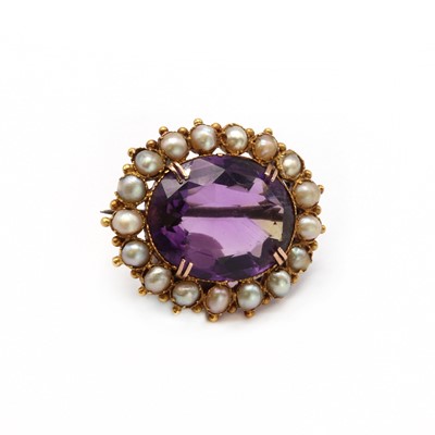 Lot 2 - A Victorian gold amethyst and split pearl brooch