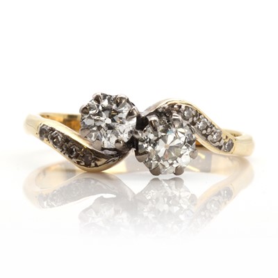 Lot 419 - A two stone diamond crossover ring