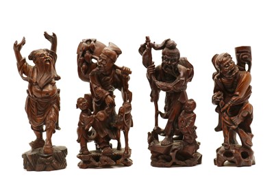 Lot 147 - A group of four Chinese hardwood figures
