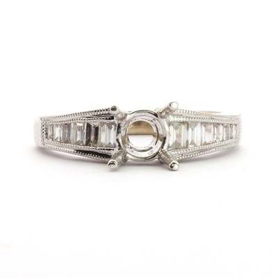 Lot 73 - An 18ct white gold vacant ring mount, with diamond set shoulders