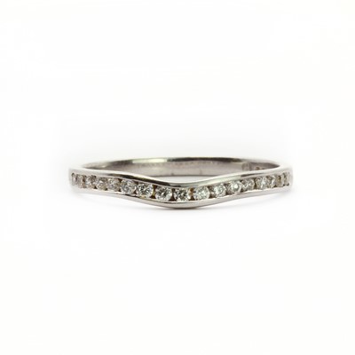 Lot 74 - A 9ct white gold fitted half eternity ring