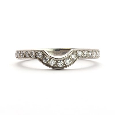 Lot 69 - A platinum diamond set half eternity ring