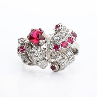 Lot 166 - An abstract diamond and synthetic ruby ring