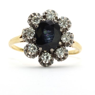 Lot 123 - A gold sapphire and diamond floral cluster ring