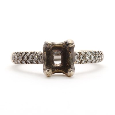 Lot 65 - An 18ct white gold vacant ring mount, with diamond set shoulders