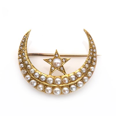 Lot 23 - A Victorian gold split pearl star and crescent brooch