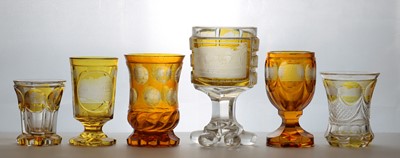 Lot 216 - A group of six Bohemian amber flashed glass spa beakers